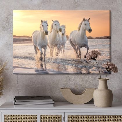 Canvas print white horses by the sea at sunset
